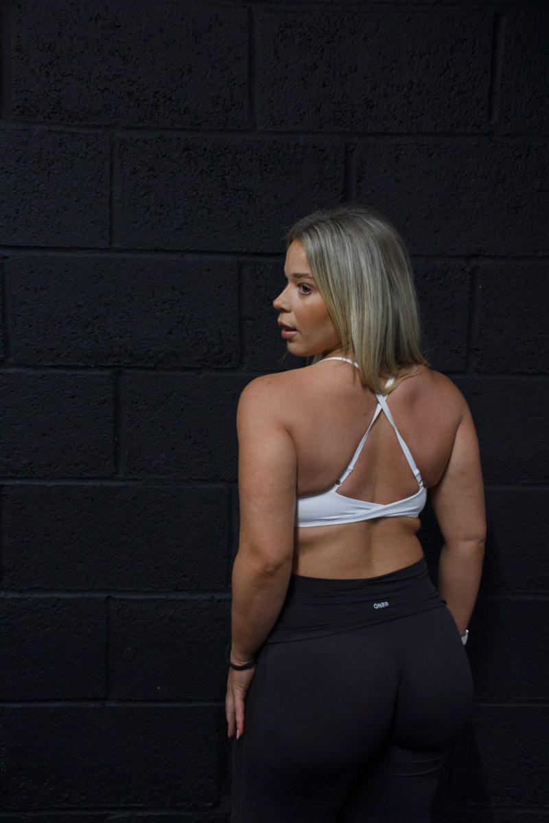 Coach looking behind while waling in the gym